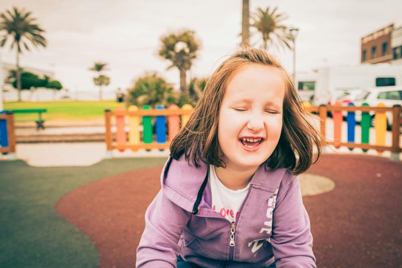 An image of a young girl in a park